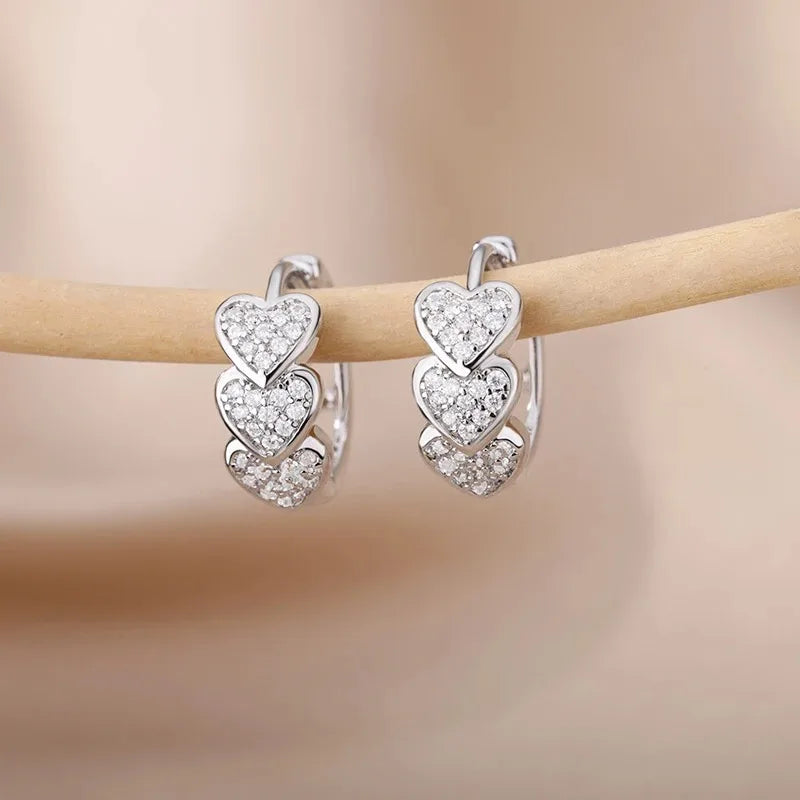 Hollow zircon heart earrings